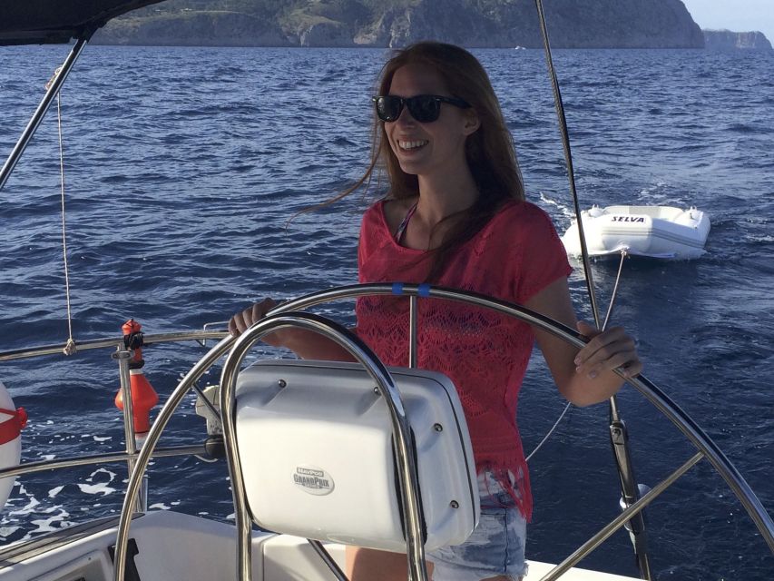 Alcudia: Sailing Yacht Excursion with Wine & Tapas - Taking the helm with the sailing crew