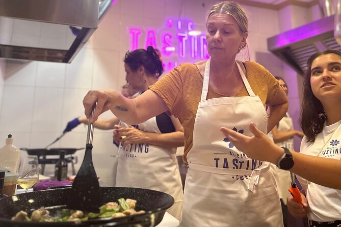 Alicante Paella Cooking Class, Tapas, Drinks and Marketplace - Preparing paella with the group