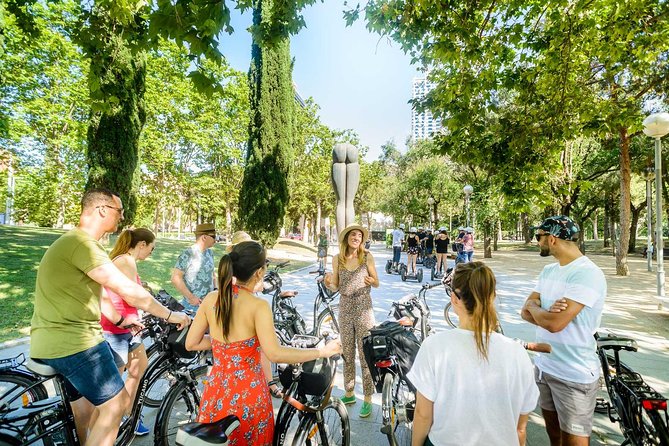Barcelona E-Bike Small Group Tour with Tapas & Wine Tasting - Barceloneta: old fishing quarter, new beach culture