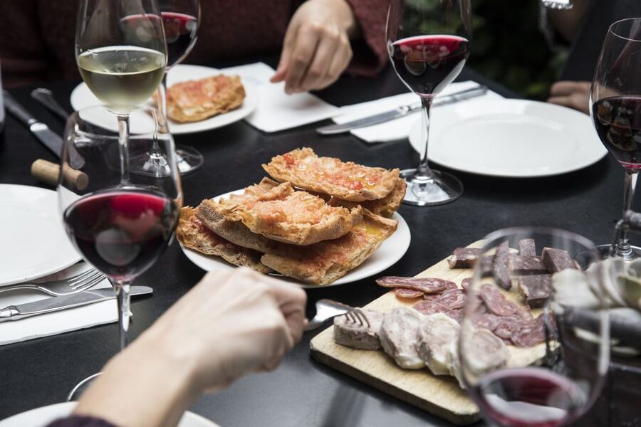 Barcelona Gourmet Food & Wine Tour with Local Expert - Stop three: seasonal cooking at an intimate restaurant