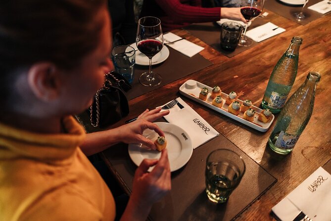 Barcelona: Guided Food Walking Tour with Tapas and Wine - Carrer Ample and the first tapas table