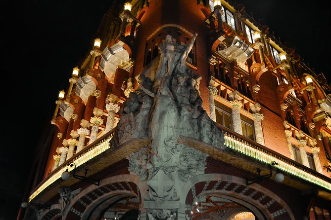Barcelona Night Bike Tour with Local Tapas and Cava Stop - Port Vell beneath the Columbus Monument