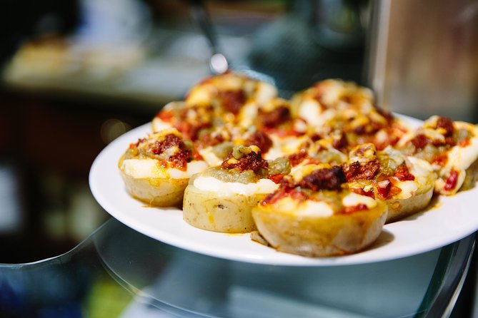Barcelona Night Bike Tour with Local Tapas and Cava Stop - The tapas stop and what you actually pay for