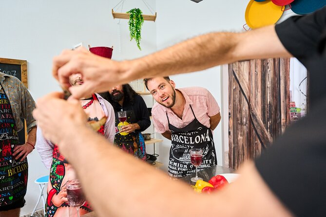 Barcelona Paella Cooking Class with Market Visit, Tapas & Sangria - Cooking paella with a real role at every step
