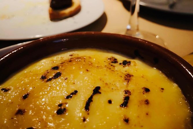 Barcelona Poble Sec Tapas & Wine Tour - The mosaic façade and the city between bites