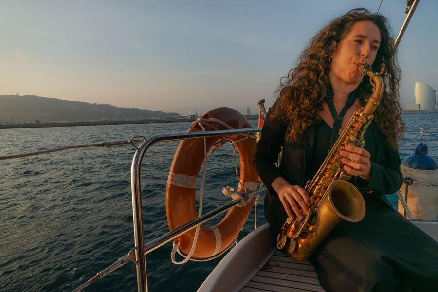 Barcelona: Sunset Live Sax and Sailing Experience with Tapas - The Mediterranean swim stop