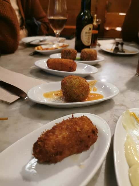 Barcelona: Tapas and Wine at the Hidden Bodegas Experience - Iberian ham, cured tuna, and Atlantic anchovies