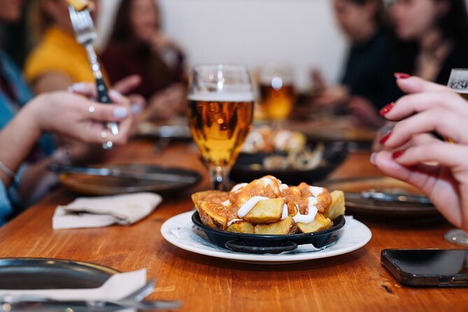 Barcelona Tapas Food Walking Tour with Wine in El Born - First Plates on Carrer Ample