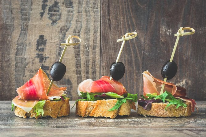 Barcelona Tapas & Wine Private Tour in Traditional Taverns - Beef tapa and red wine on Carrer de Montcada