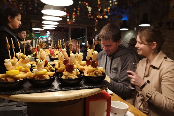 Barcelona: Tapas & Wine, Private Tour in Traditional Taverns - Meeting beside El Molino Theatre