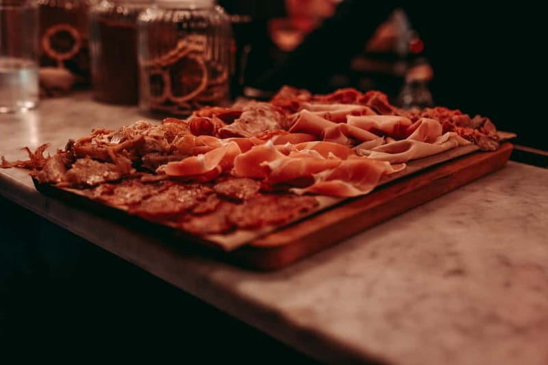 Barcelona: Tipsy Tapas & History Tour in the Gothic Quarter - Stop three: a final board, bold flavors, and live music