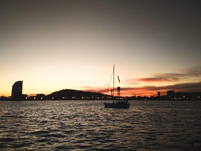 Barcelona: Unique Sunset Sailing Tour with Tapas & Open Bar - Leaving Port Olímpic as Barcelona cools down