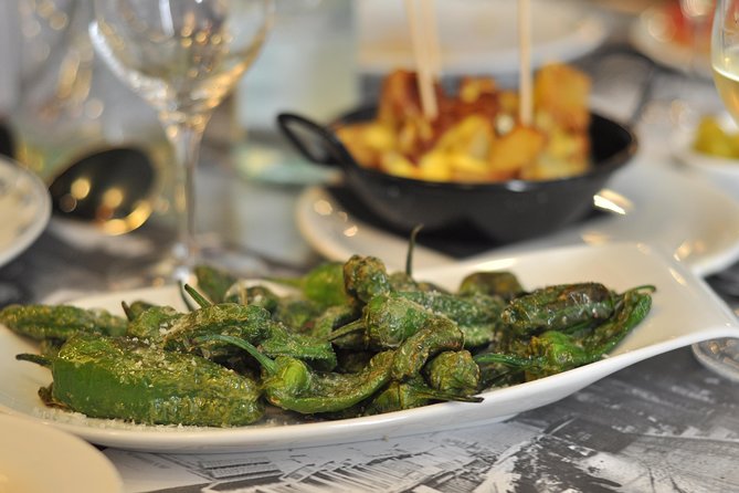 Born to Eat: Gourmet Tapas & Wine Small Group Tour in Old Barcelona - Mercat del Born and the city below the market