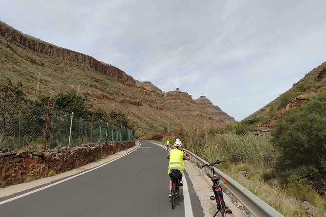 Electric Bike Panoramic South Coast Tour Optional Fishing Tapas - The lighthouse, old stone houses, and La Charca