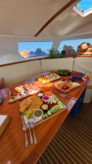 From Palma: Luxury Catamaran Group Tour with Tapas & Drinks - What to pack for a comfortable afternoon