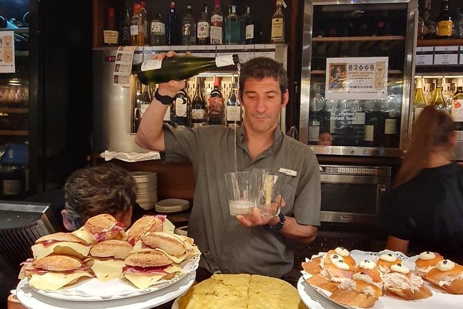 Full-day private Bilbao tour (Guggenheim museum & full pintxo lunch included) - Crossing Bilbao on the Zubizuri Bridge