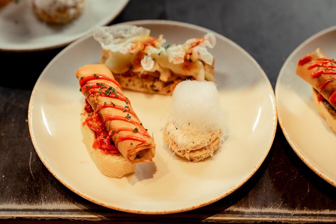 Gourmet Pintxos & Premium Wines small groups Food Tour - Entering Plaza Nueva and the Seven Streets
