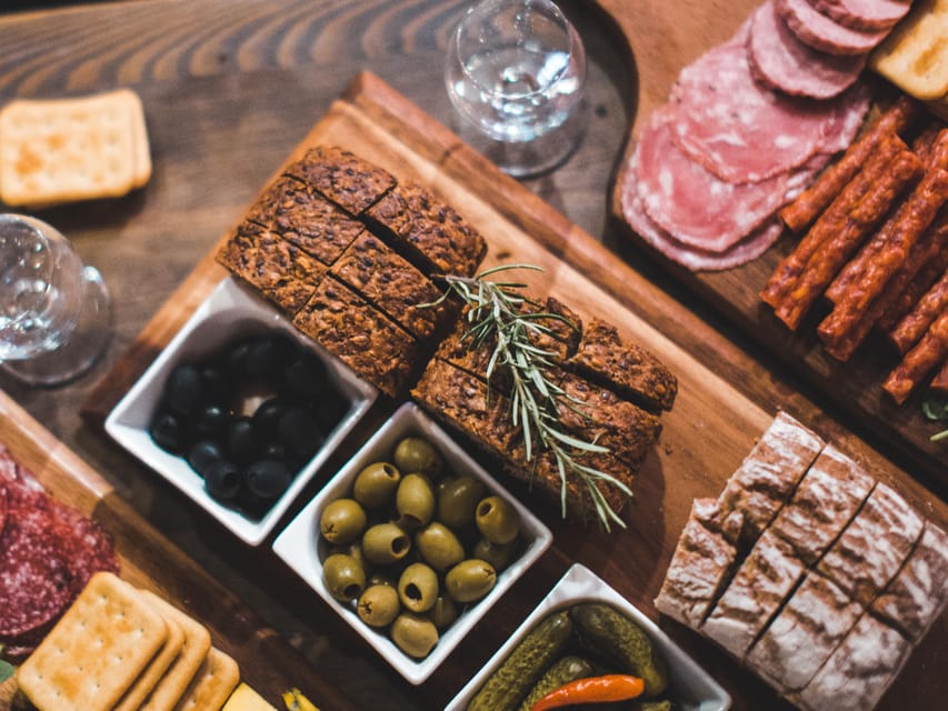 Krakow: Vodka Tasting Tour: Tapas, Tipsy Tales & Hidden Gems - Starting with bread, cheese, and a Polish lesson