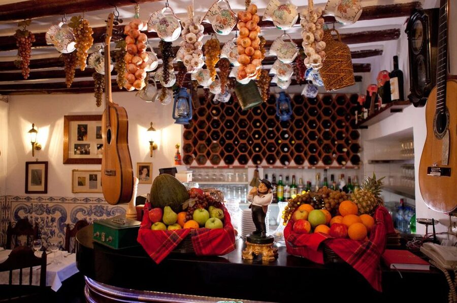 Lisbon: Alfama Charms, Tapas, Wine and Sunset Boat Cruise - Portuguese tapas in a local tavern