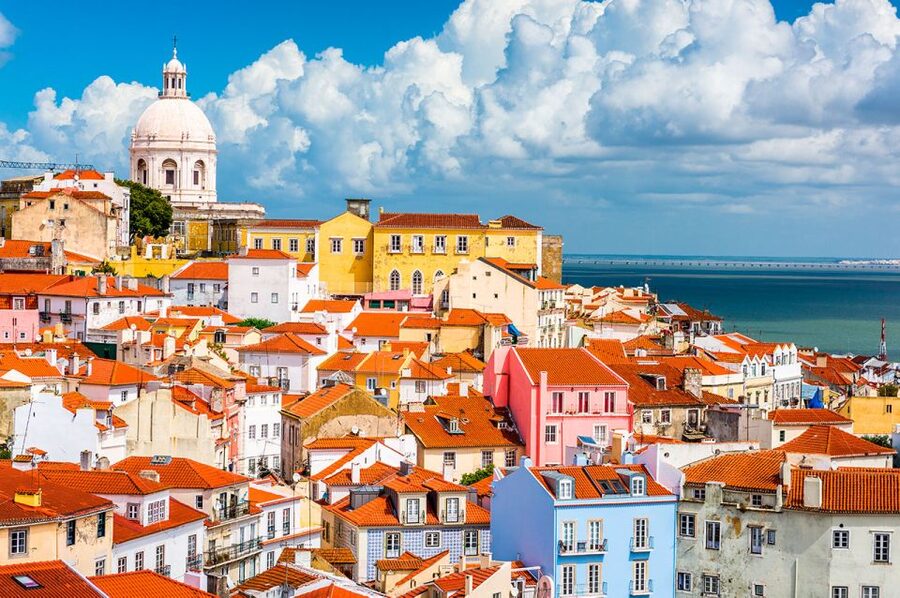 Lisbon: Alfama Charms, Tapas, Wine and Sunset Boat Cruise - Sailing the Tagus as Lisbon lights up