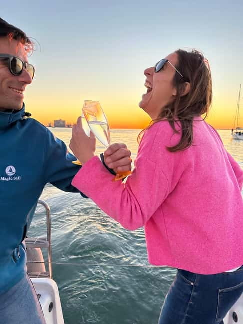 Lisbon: Romantic Cruise with Wine & Portuguese Tapas - Alfama and the riverfront hills