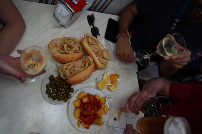 Madrid by Night: Tapas Crawl, Local Drinks & Hidden Gems - Shrimp, house wine, and the final sweet course