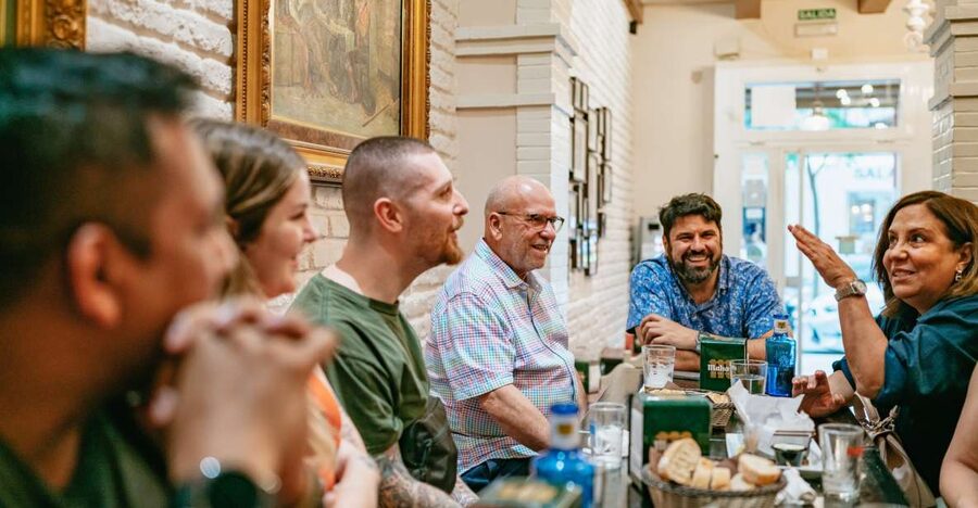 Madrid: Food & Wine Tour with 10 Tapas & 4 Drinks Included - Stop two: the neighborhood bar where locals eat