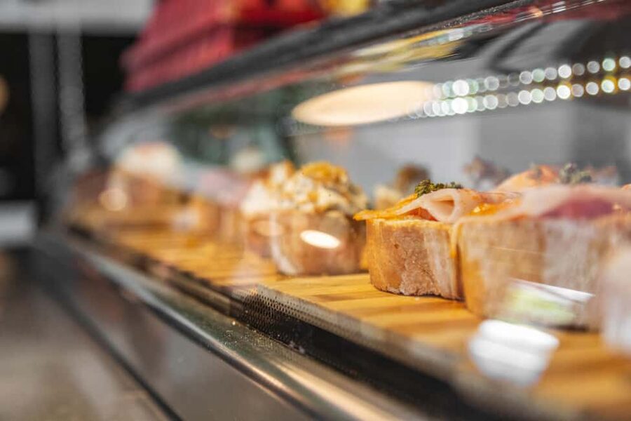 Madrid: Guided Food Tour with Authentic Tapas & Delicacies - Starting with tortilla, cheese, and old tavern atmosphere
