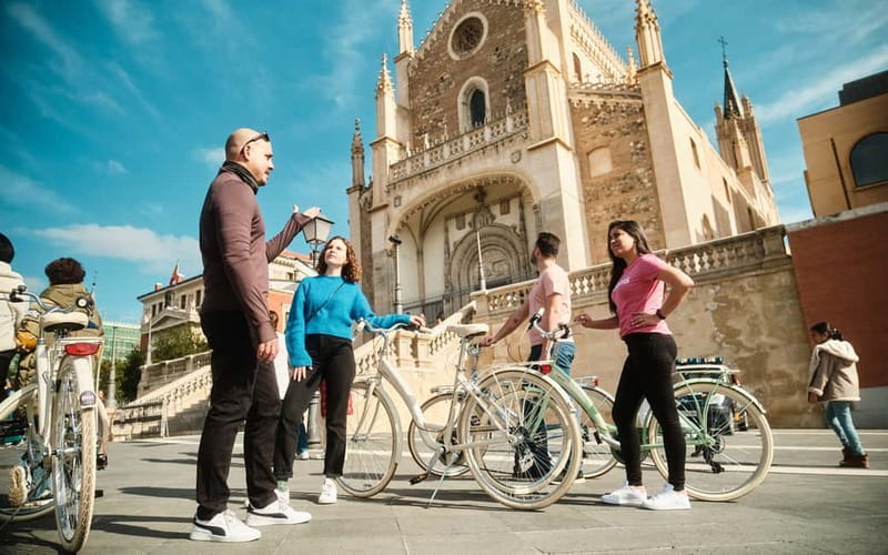 Madrid: Highlights Guided Vintage Bike Tour and Tapas Option - Puerta del Sol and Madrid’s familiar symbols