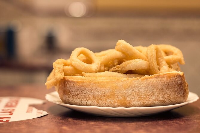 Madrid Historic Centre Food Tour with Authentic Tapas & Wines - The famous Madrid squid sandwich