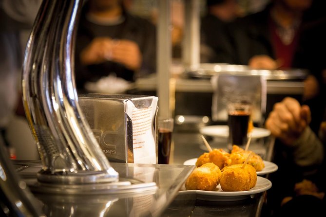 Madrid Local's Tapas Tour Dinner with a side of History - Calle Preciados and a croquette stop dating to 1860