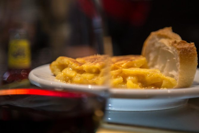 Madrid Local's Wine and Tapas Lunch Tour with a side of History - Starting at Plaza Isabel II with a first glass of wine