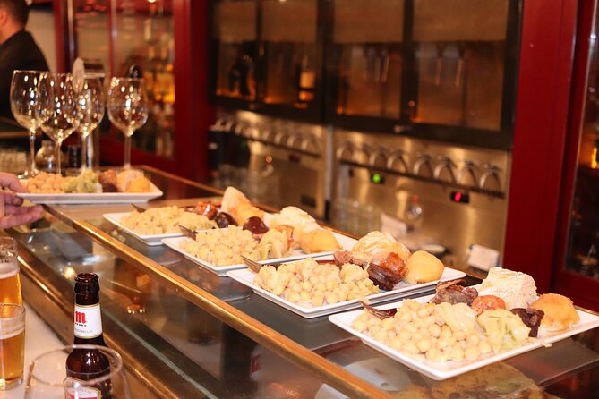 Madrid Small Group Tapas Tour at 4 Venues -Lunch or Dinner - Iberian ham, cold cuts, and what the price buys