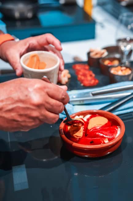 Madrid: Tapas Cooking Class with bottomless Wine Pairing - Why this Madrid food class feels different