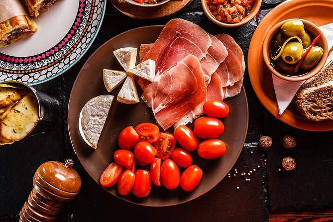 Madrid Tapas Experience Walking Tour - Cider, wineskin, and the social side of the tour