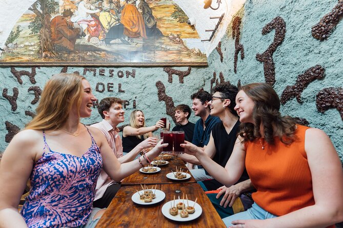 Madrid: Tapas Walking Tour with Food and Drinks Included - Cava de San Miguel and chorizo-stuffed mushrooms