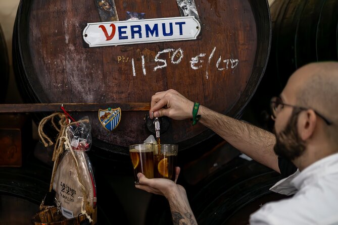 Malaga Food Tour with 12+ Tastings: Tapas, Olive Oil, Ham & More - Spending an hour at Atarazanas Market