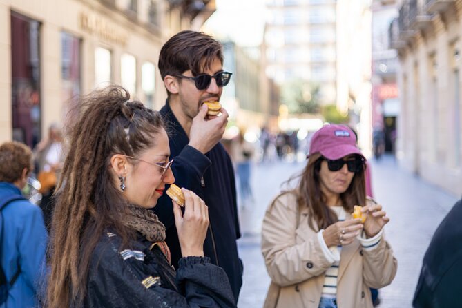 Malaga Food Tour with 12+ Tastings: Tapas, Olive Oil, Ham & More - Ham, cheese, salami, and Málaga flavors