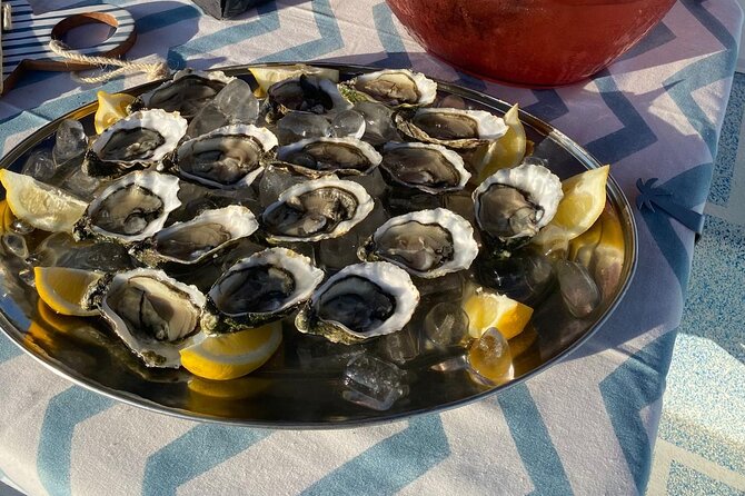 Olhão: Private Boat Tour, at Sunset with Oysters/Tapas and Drinks - Farol Island and the late-day light