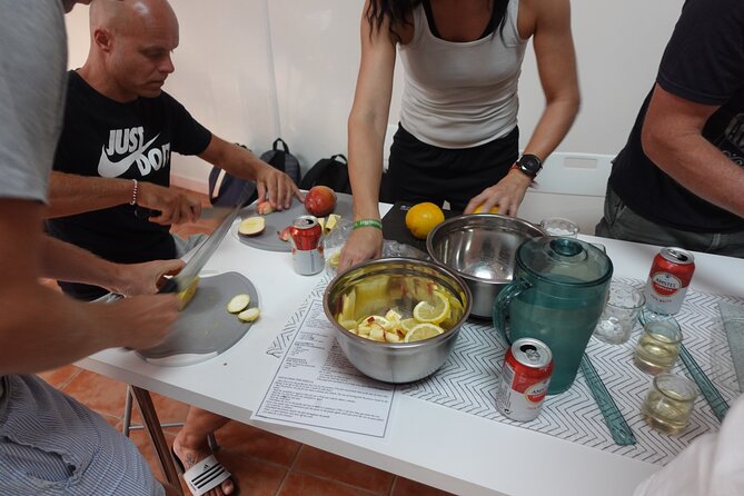 Paella & Sangria Class with Tapas and Market Visit - Learning paella through broth and salmorreta