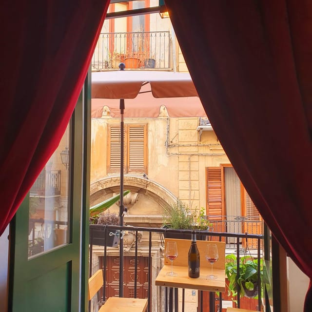 Palermo: Wine Tasting with Sicilian Tapas - The balcony overlooking an 18th-century church