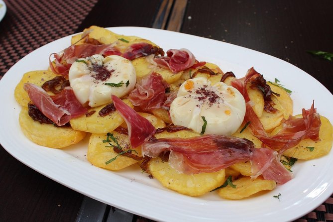 Palma de Mallorca 3-Hour Highlights and Tapas Tasting Bike Tour - Sa Llotja and Palma’s trading past