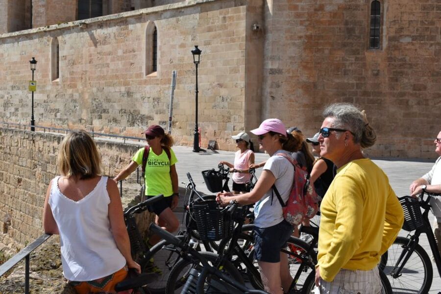 Palma de Mallorca: Guided Bicycle Tour with Tapas & a Drink - Turning into the old town