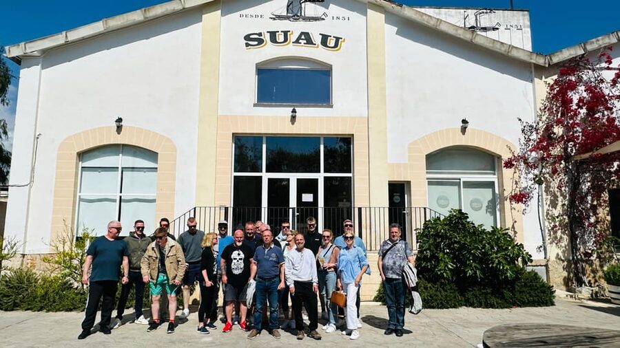 Palma: Distillery Tour with 6 Spirits and Tapas Tasting - Following the Tour from the Courtyard to the Barrels