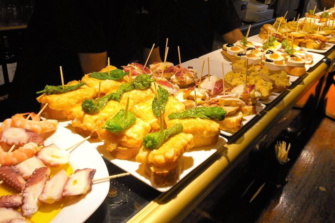 Private Barcelona Art and Tapas Walking Tour with Picasso Museum - The final stop: Spanish and Catalan meat dishes