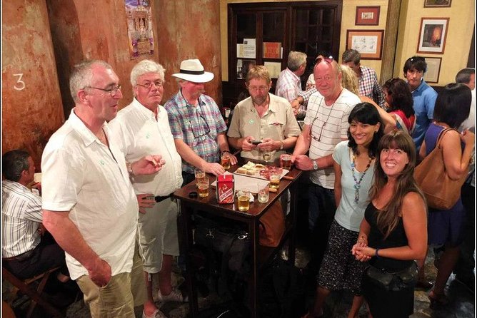 Private off the beaten path Tapas Tasting in Seville - Crossing the Triana Bridge into Seville’s old neighborhood
