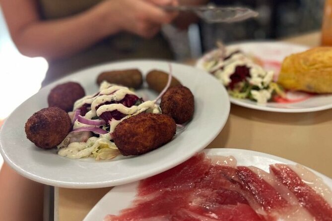 Private Seville Flamenco & Tapas Experience - Walking through Santa Cruz after dark