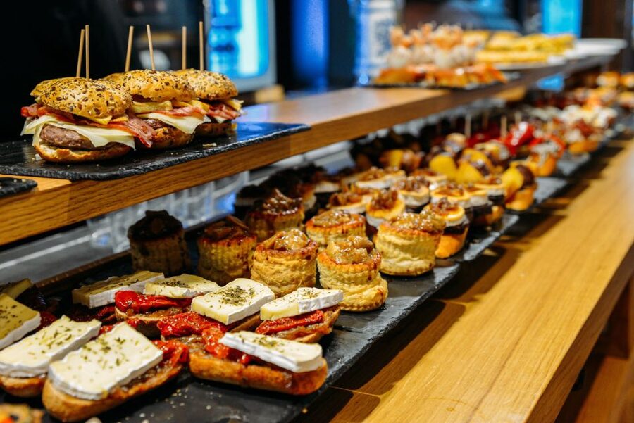 San Sebastian: Historical Walking Tour with Pintxo and Drink - Plaza de Okendo and the Boulevard show daily city life