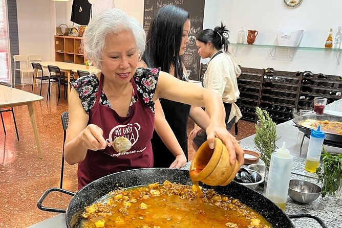 Seafood paella cooking class, tapas and visit to Ruzafa market. - Sangria, tapas, and the long Valencian table