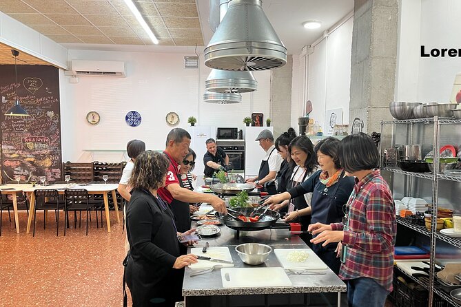 Seafood paella cooking class, tapas and visit to Ruzafa market. - Making seafood paella, one job at a time